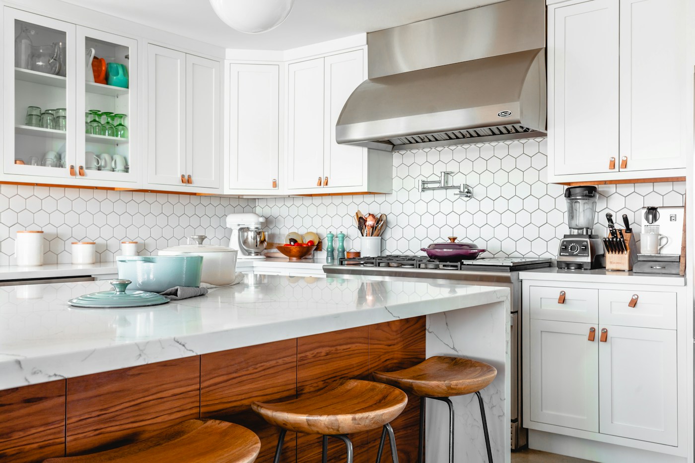 Kitchen inspiration with white cabinetry, natural stone and warm wood