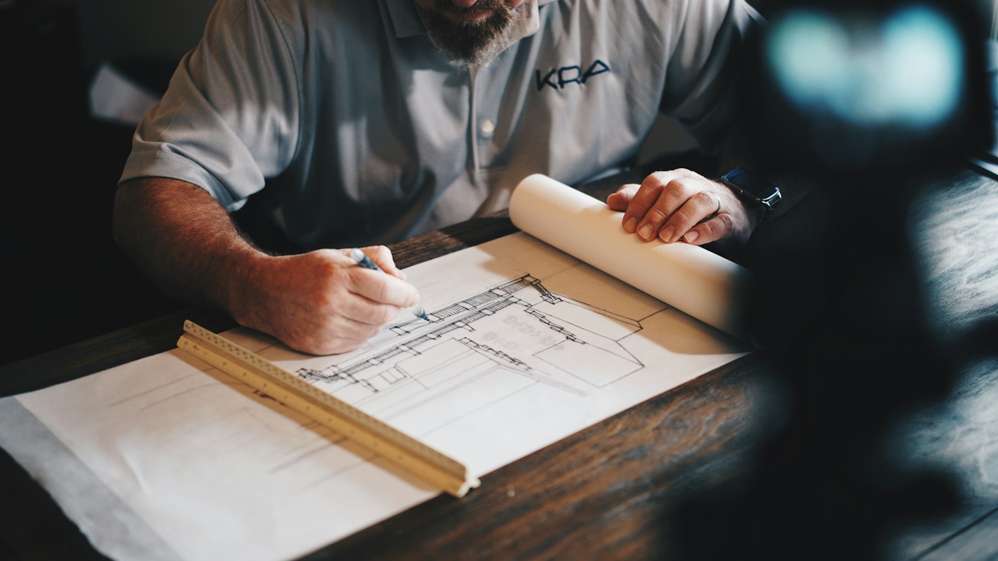 Architectural plans being reviewed at a desk
